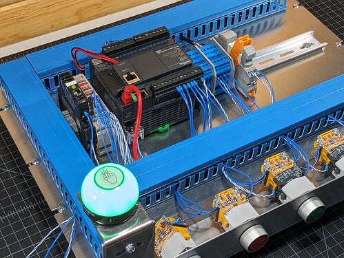 PLC trainer on the author's workbench featuring a Schneider PLC.