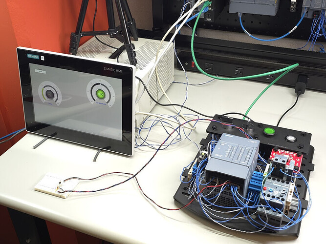 Figure 1: PID project on the author’s workbench showing PLC, HMI, and the heater / sensor installed on a breadboard.