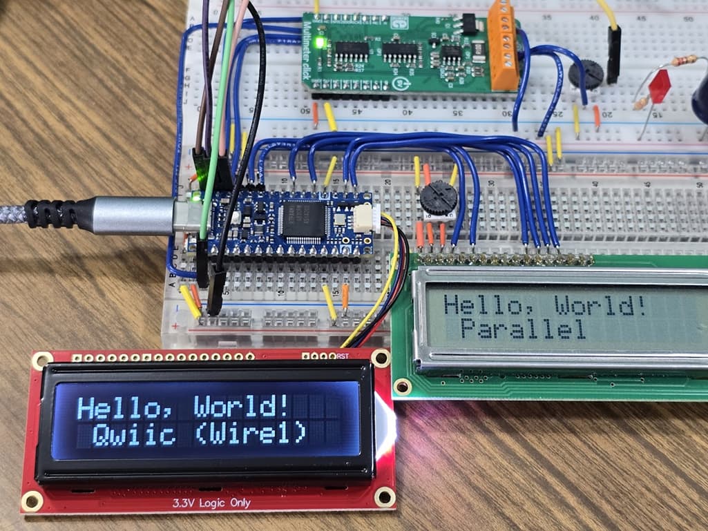 Figure 1: Author’s workbench showing the Arduino Nano R4 connected to both a Qwiic LCD and a Parallel connected LCD.