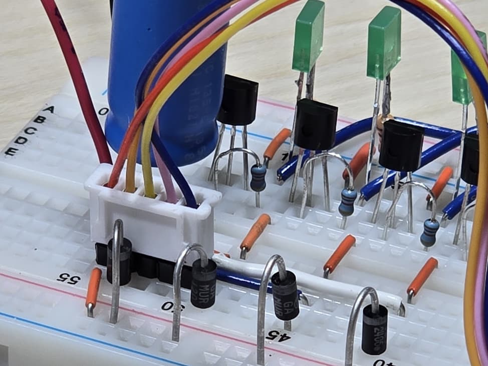 Figure 2: A flyback diode is included across each motor winding. A series resistor is included for each transistor base.