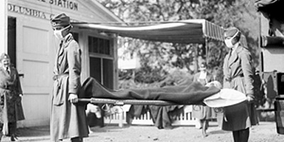 nurses carrying patient on stretcher