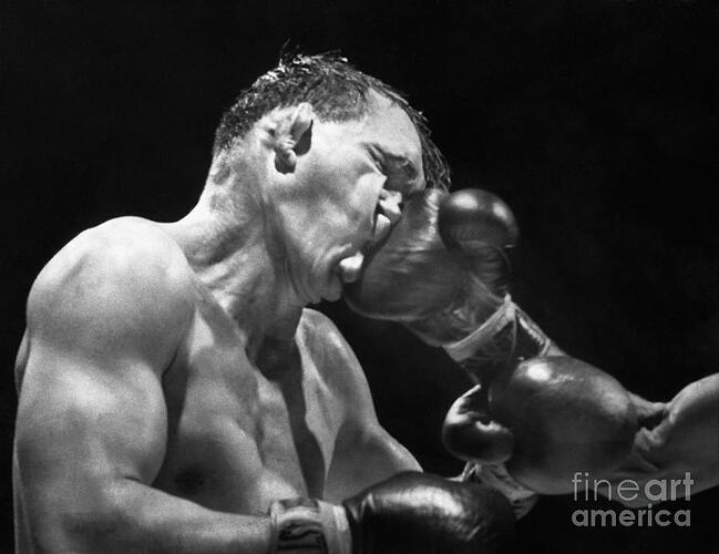 gene-fullmer-being-hit-during-boxing-bettmann