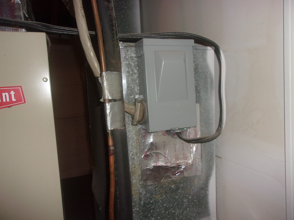 Service disconnect for furnace mounted on ductwork Inspecting HVAC