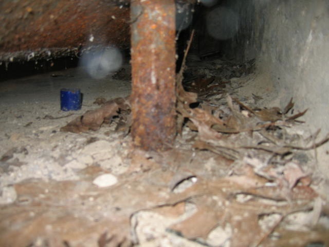 ben-gromicko-deteriorated-rusted-flaking-leg-of-oil-storage-tank.jpg