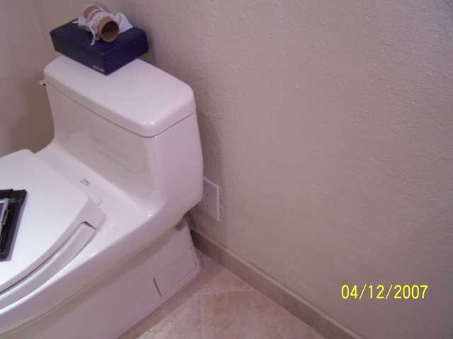 outlet behind toilet.jpg