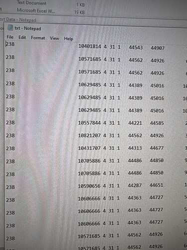 A screenshot of a Notepad document displaying columns of numerical data. (Captioned by AI)