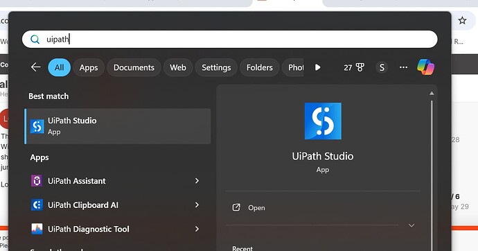 The image shows a Windows search menu with a user searching for "UiPath," displaying results for UiPath Studio, UiPath Assistant, UiPath Clipboard AI, and UiPath Diagnostic Tool. (Captioned by AI)
